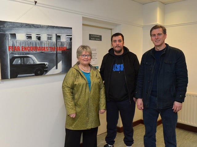 Artist Square Bear (centre) pictured with Kate Nash and Colr Shaun Harkin at the launch of his exhibition ‘Injustice’ at the Eden Arts Centre on Monday evening last. The exhibition commemorating the 51st anniversary of Bloody Sunday runs until 1st February next.  Photo: George Sweeney. DER2305GS – 79