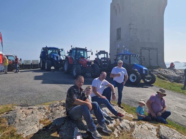 Drivers and children gathered by the tower before the Inish Tractor Run.
