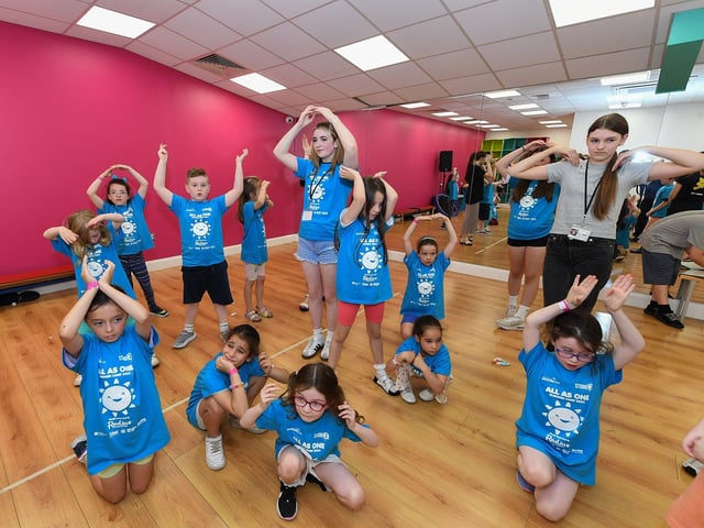 Some of the children and volunteers from across the community who participated in the week long Good Relations, arts based, Summer Camps held at Studio, supported by Radius Housing Association. Photo: George Sweeney