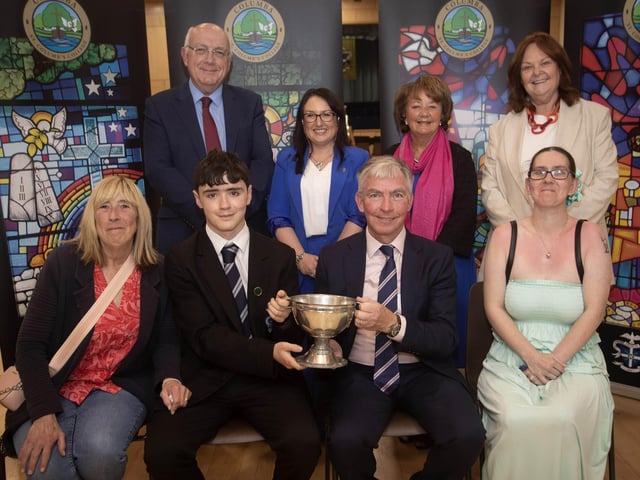 Reece O'Doherty receiving the The Niall McBrearty Memorial Trophy from Mr. Niall Downey, guest speaker, at Thursday's St. Columb's College Prizegiving. Included at front is Reece's mother and grandmother. At back are Mr. P. Kelly, board of governors, Mrs. C. McLaughlin, Principal, Ms. M. Hamilton and Mrs. G. Canavan, board of governors.