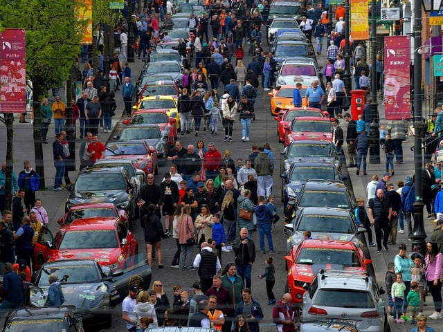 People visit the super cars and American Muscle cars that took part in the Bear Run from Derry’s Shipquay Street to Donegal and Inishowen, on Saturday morning, raising funds for Bumbleance, the Children’s Ambulance Service. Photo: George Sweeney. DER2317GS – 117