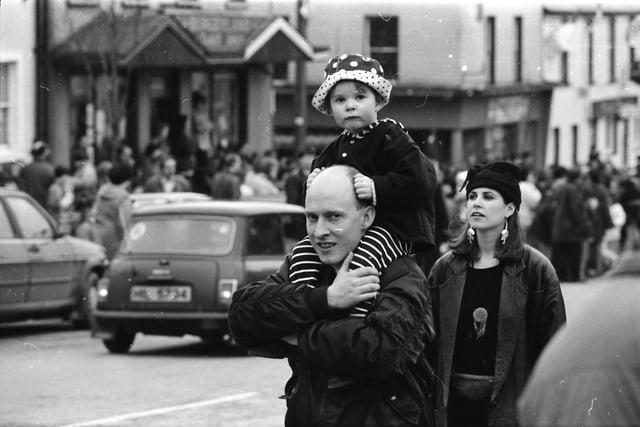A young reveller with a perfect view spots the Journal photographer at the St. Patrick's Day parade in Moville on March 17, 1993.