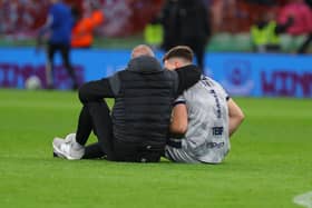 Derry City goalkeeping coach Michael Dougherty consoles Brian Maher after Derry's defeat in the FAI Cup Final at the Aviva Stadium. Credit: Kevin Moore/MCIphoto