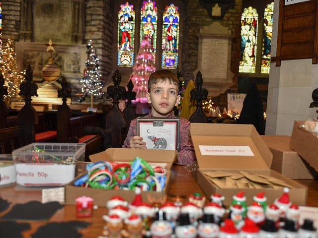 Mark beside his seasonal stall in St Columb's Cathedral as part of the annual Christmas Festival.  Photo: George Sweeney
