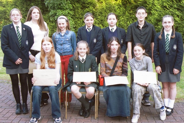 Some of the prizewinners in the Children in Crossfire writing event were Front L/R:- Rachel Crawford, Michelle McDevitt, May Alexander and Rebecca Dempsey. Standing L/R:- Kirsty Reilly, Bronagh Kelly, Alison O'Connell, Sarah Bartlett, Kerry Canavan, Steven Laverty and Pamela Adams. 260603HG1