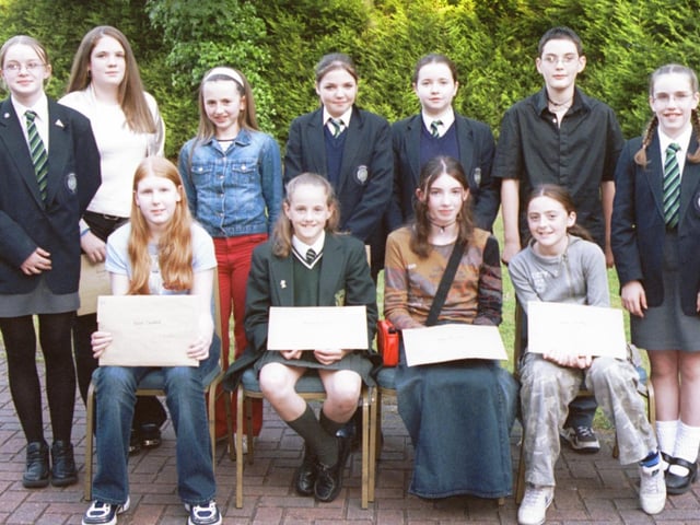 Some of the prizewinners in the Children in Crossfire writing event were Front L/R:- Rachel Crawford, Michelle McDevitt, May Alexander and Rebecca Dempsey. Standing L/R:- Kirsty Reilly, Bronagh Kelly, Alison O'Connell, Sarah Bartlett, Kerry Canavan, Steven Laverty and Pamela Adams. 260603HG1