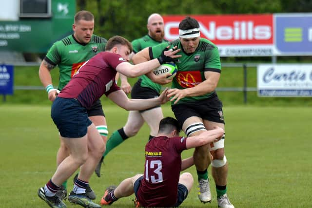 Enniskillen’s James Balfour tackles Gerard Doherty of City of Derry. Photo: George Sweeney.  DER2316GS – 54