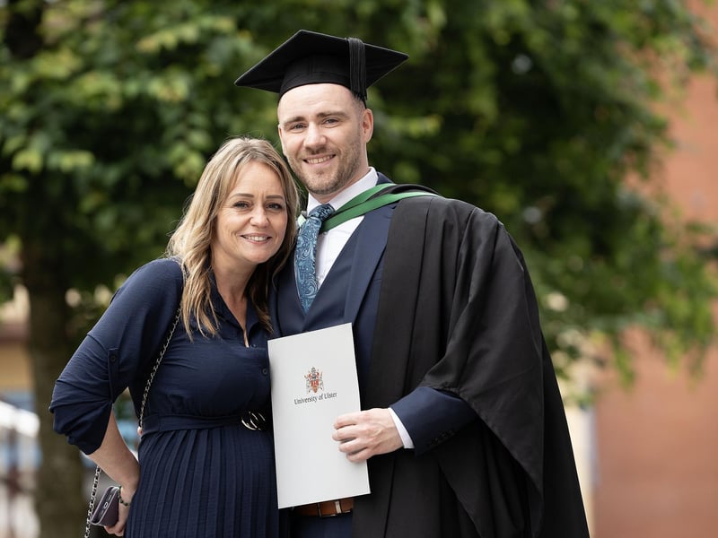 Sean McMullan from Eglinton celebrates with his partner Zara as he graduates with a degree in Information Technologies from Ulster University in Derry on Monday July 8. (Photo: Nigel McDowell / Ulster University)