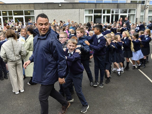 Teacher Mr. Quinn and pupils from Rosemount Primary School enjoy the entertainment from the Jive Aces on Thursday morning. Photo: George Sweeney