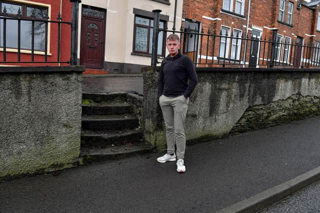 Sinn Fein MLA Padraig Delargy pictured beside dilapidated steps leading to homes in Stewart’s Terrace and Keer’s Terrace on Creggan Road. Photo: George Sweeney. DER2311GS – 21