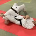 Aileach Karate Club instructor, Seamus Gillespie, performs a self defence demonstration with the help of clubmate Gareth Walker.
