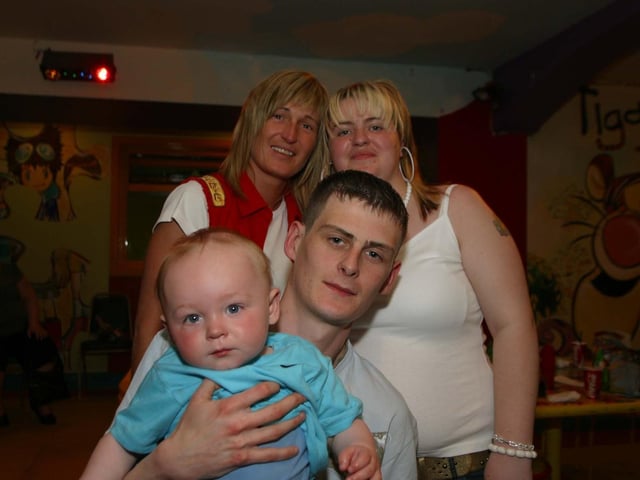Birthdfay BoyTerna Porter with Godparents John, Orlagh and Tracey enjoying the party in Bannans. 2945/dd : Parties and celebrations across Derry in May 2006.