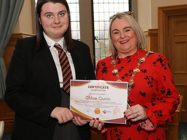 Mayor presents a certificate to Chloe Quinn, a student at St. Brigid's College, for completing the following courses, food hygiene, health and safety and First Aid. The course was held at Skeoge Community Hub in partnership with St. Brigid's College. (Photo - Tom Heaney, nwpresspics)