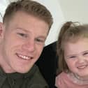 ALL SMILES . . . Wigan Athletic winger James McClean and his daughter Willow