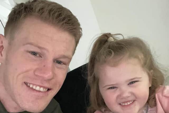 ALL SMILES . . . Wigan Athletic winger James McClean and his daughter Willow