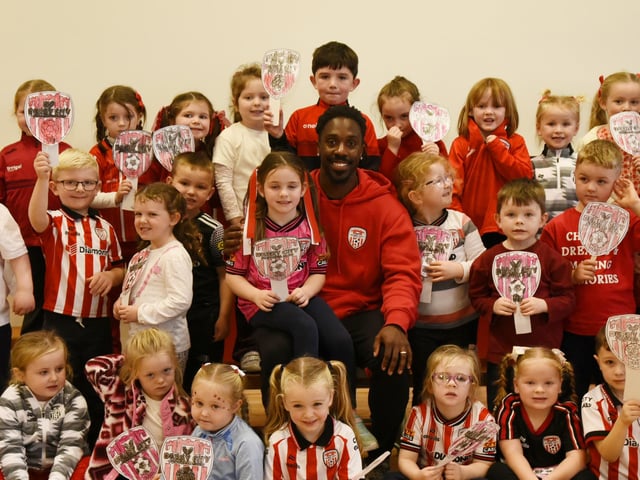 Derry City Football Player Kevin dos Santos with some of the Primary One children