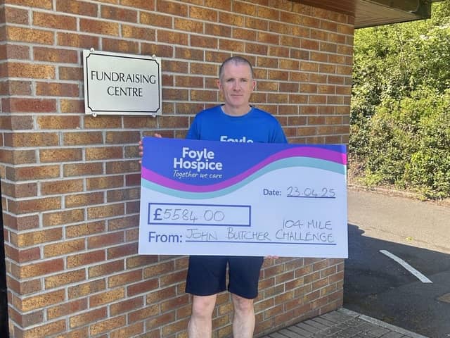 John Butcher pictured presenting a cheque for £5,584 , proceeds from running 104 miles throughout Limavady in aid of Foyle Hospice.