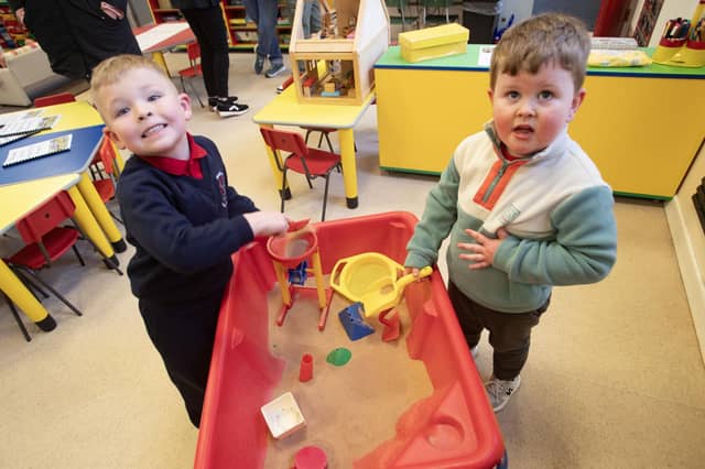 Cousins and prospective Model PS pupils James Weir and Kenny Devlin having some fun playing with the sand during Open Day. : .