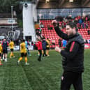 Derry City boss Ruaidhri Higgins salutes the home crowd after a big win over St Pat's in the FAI Cup second round at Brandywell. Photographs by George Sweeney.