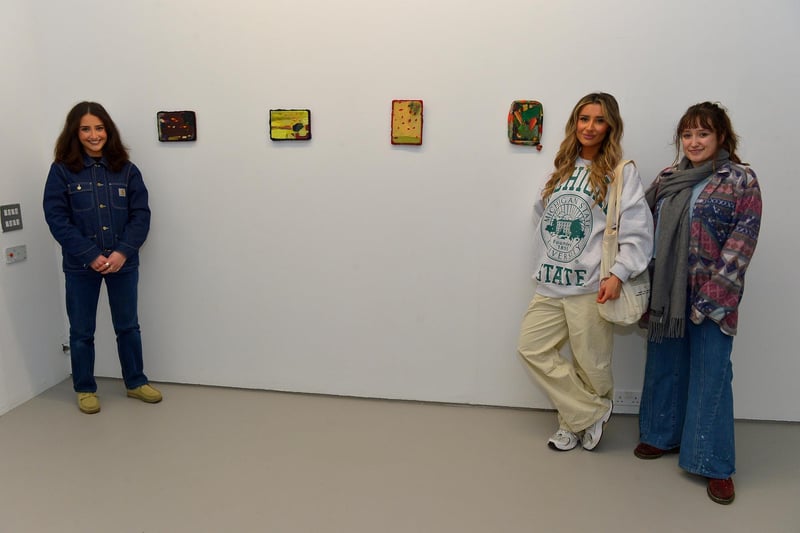 Derry born artist Yasmine Robinson, on the left, pictured with Amber Robinson and Emily McMillan alongside her exhibit ‘The Pits’ at the Centre for Contemporary Art’s ‘Urgencies’ Exhibition which runs until 18th March next. Photo: George Sweeney. DER2304GS – 27