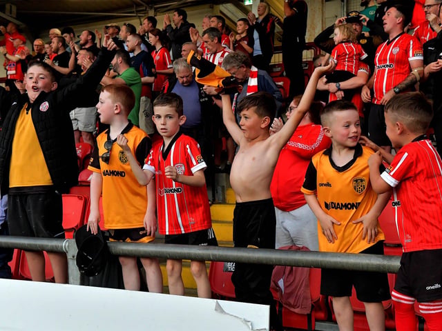 Derry City fans celebrate Will Patching’s winning goal against against Sligo Rovers on Friday evening. Photo: George Sweeney. DER2327GS – 073