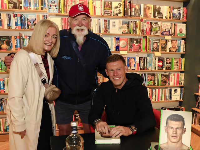 Professional footballer James McClean signing his autobiography, “The Walls” in Waterstones, Foyleside, for Noel Moore and Nuala McGee. (Photo - Tom Heaney, nwpresspics)