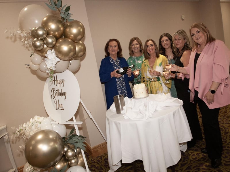 The birthday girl Úna pours a glass of bubbly for the main organisers of the occasion on Saturday.