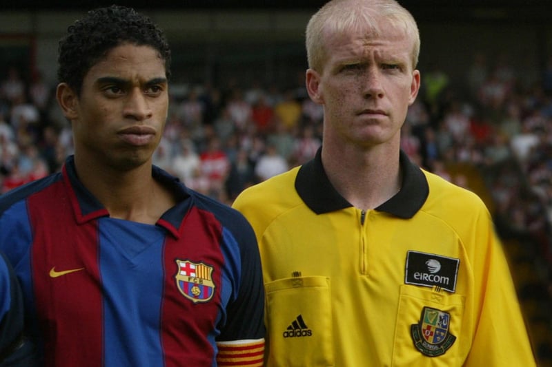 Donegal referee Paul Duddy with Barcelona captain Michael Reiziger.