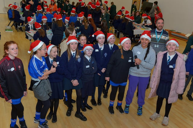 Pupils from St Brigid’s Primary School enjoy the carol singing at the St Cecilia’s College Christmas Workshop on Friday morning.  Photo: George Sweeney. DER2248GS – 85