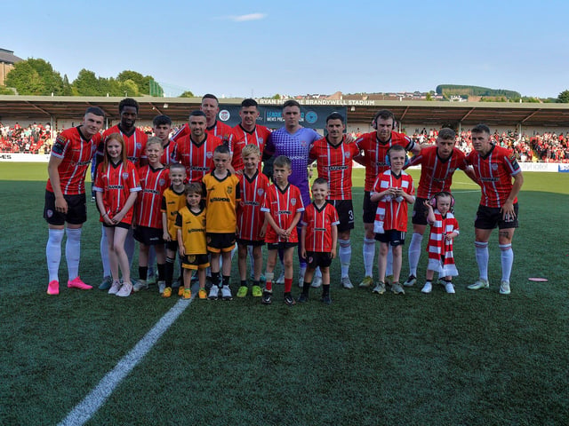 Mascots pictured with the Derry City starting eleven against Bohemian on Friday evening. Photo: George Sweeney. DER2322GS – 153