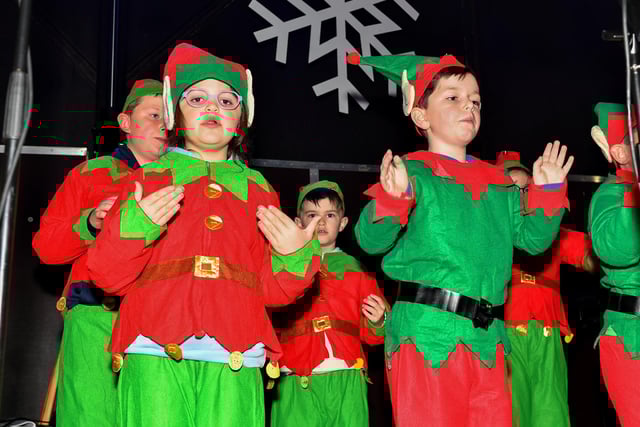 Pupils from Culmore Primary School choir singing at the Elf Parade and Christmas Lights switch on at the Community Hub on Friday night. Photo: George Sweeney