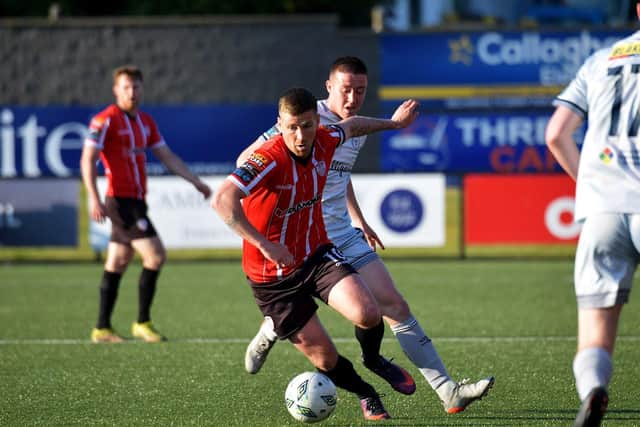Derry City’s captain Patrick McEleney shields the ball from Shelbourne’s Andrew Quinn. Photo: George Sweeney. DER2321GS -