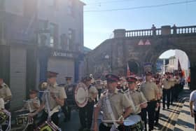 Band members marching along Ferryquay Street on Monday. Jack Tibbetts.