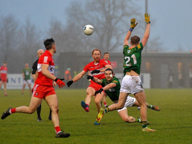 February 2023: Derry’s Conor Glass gets off a pass under pressure from Meath’s Cillian O’Sullivan during an Allianz League campaign that would end in promotion for the Oak Leafers. Photo: George Sweeney.
