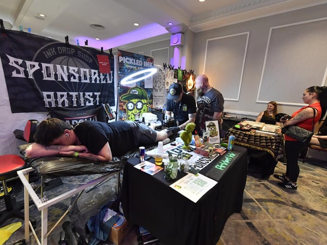 Tattoo artists at the annual Maiden City Ink International Tattoo Convention held in the Everglades Hotel. Photo: George Sweeney