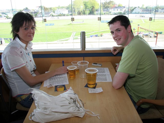 Ailish Mimnagh and Aidan Quinn study the form at the Lifford Stadium 0518JML : Parties and celebrations across Derry in May 2006.