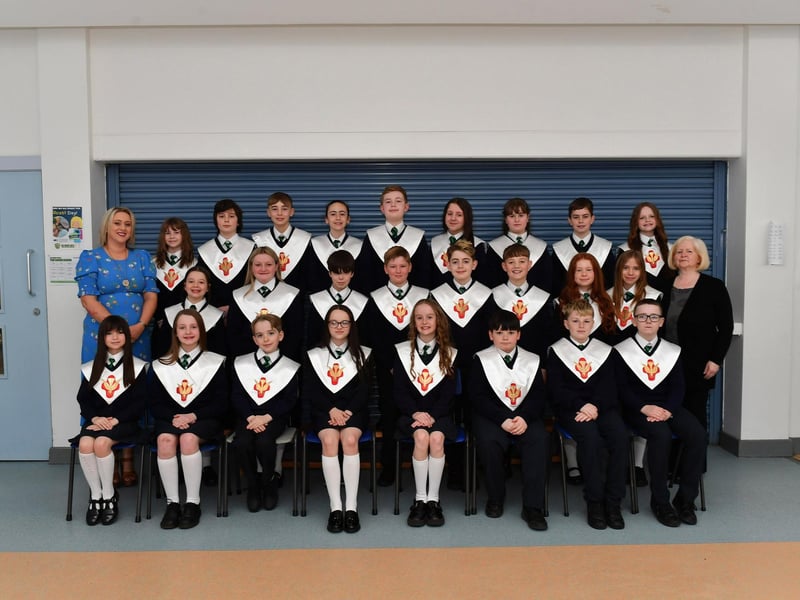 St Patrick’s Primary School teacher Mrs M. Mellon (on the left) with her P7 class who were confirmed by Fr. D. Mc Grattan in Pennyburn Church on 7th March. Included in the photograph is classroom assistant Mrs A. Gillespie. Photo: George Sweeney