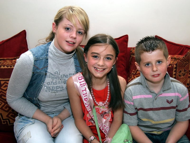 Kelsey poses for a photograph with cousins, Shannon and Ethan 0508JML : Parties and celebrations June 2006: Kelsea Doherty.