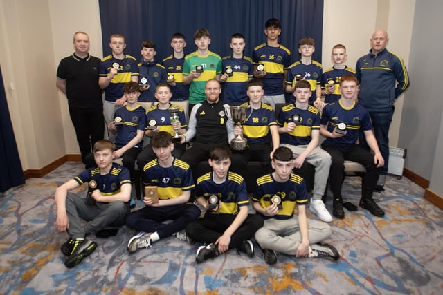 Ronan O'Donnell, Irish Football Association, special guest, presenting Don Boscos FC with the League Trophy and the Ronnie Ballard Cup at the D&D Youth Awards at the City Hotel on Friday night last. Included are coaches Liam Cooley and Liam McGilloway.