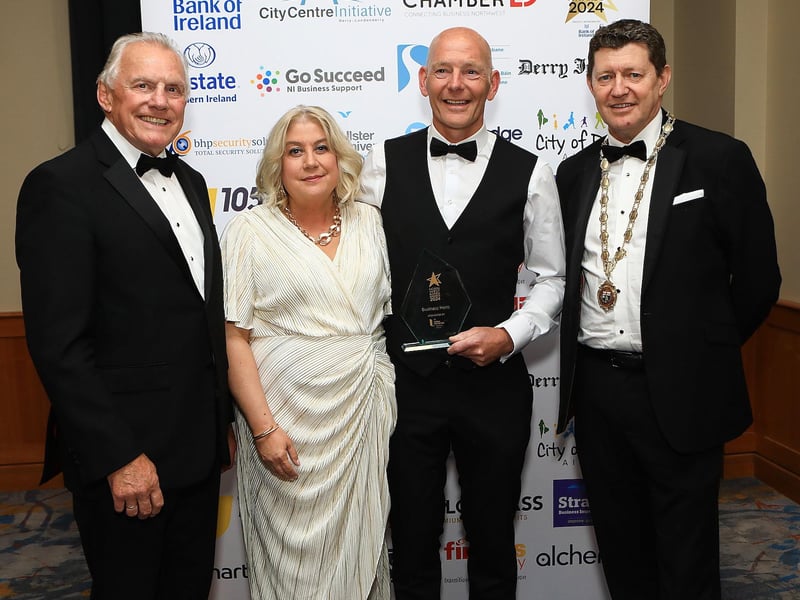 Declan Moore, named as this year's Business Hero pictured with his wife, alongside Ian Crowe and Greg McCann.
