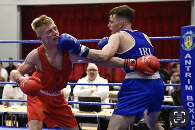 Oakleaf's Jack Harkin lands a left hook on Matty Boreland on his way to victory in the Ulster Elite Championships.