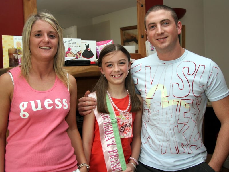 Kelsey pictured with her mum Eileen and dad Colm on the occasion of her 11th birthday 0502JML : Parties and celebrations June 2006: Kelsea Doherty.