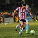 Dom Thomas of Derry City skips past Benny McLaughlin of Institute. Photograph: George Sweeney