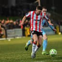 Dom Thomas of Derry City skips past Benny McLaughlin of Institute. Photograph: George Sweeney