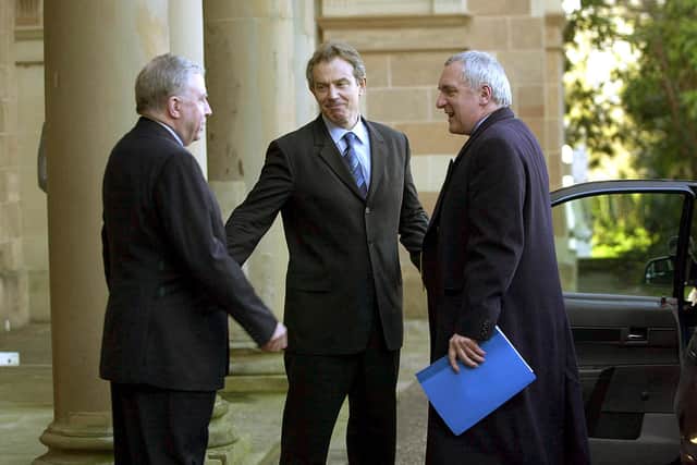 British Prime Minister Tony Blair is met by Secretary of State Paul Murphy and Taoiseach Bertie Ahern upon arriving at Hillsborough castle on February 12, 2003. (Photo by Getty Images)