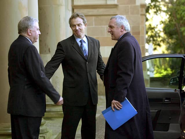 British Prime Minister Tony Blair is met by Secretary of State Paul Murphy and Taoiseach Bertie Ahern upon arriving at Hillsborough castle on February 12, 2003. (Photo by Getty Images)