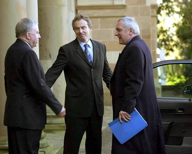 British Prime Minister Tony Blair is met by Secretary of State Paul Murphy and Taoiseach Bertie Ahern upon arriving at Hillsborough castle on February 12, 2003. (Photo by Getty Images)