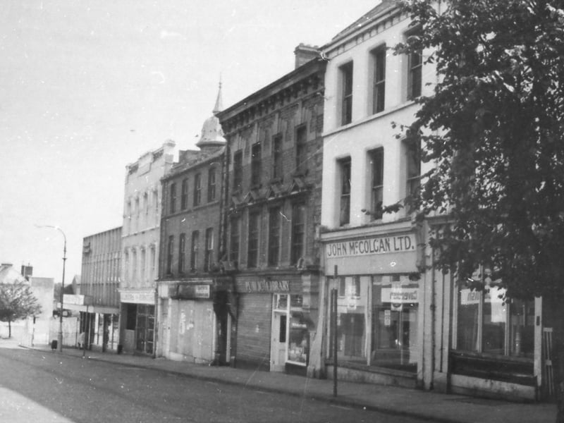 Bishop Street, early 1970s, showing some famous old shops from the past, among them McColgan's Hardware Store and Gilmour's Furniture Store.