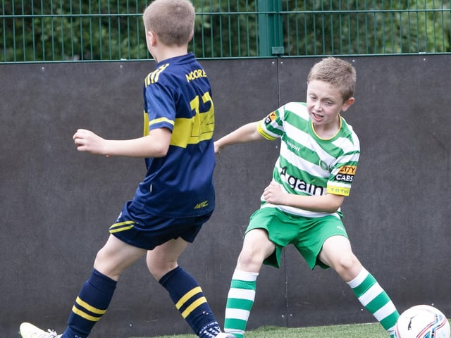 Action from one of the group games between Top of the Hill Celtic and Don Boscos.