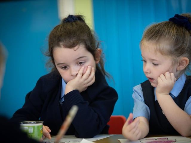 Busy 'problem solving' are P1 pupils Evelyn and Zoe at Hollybush PS.